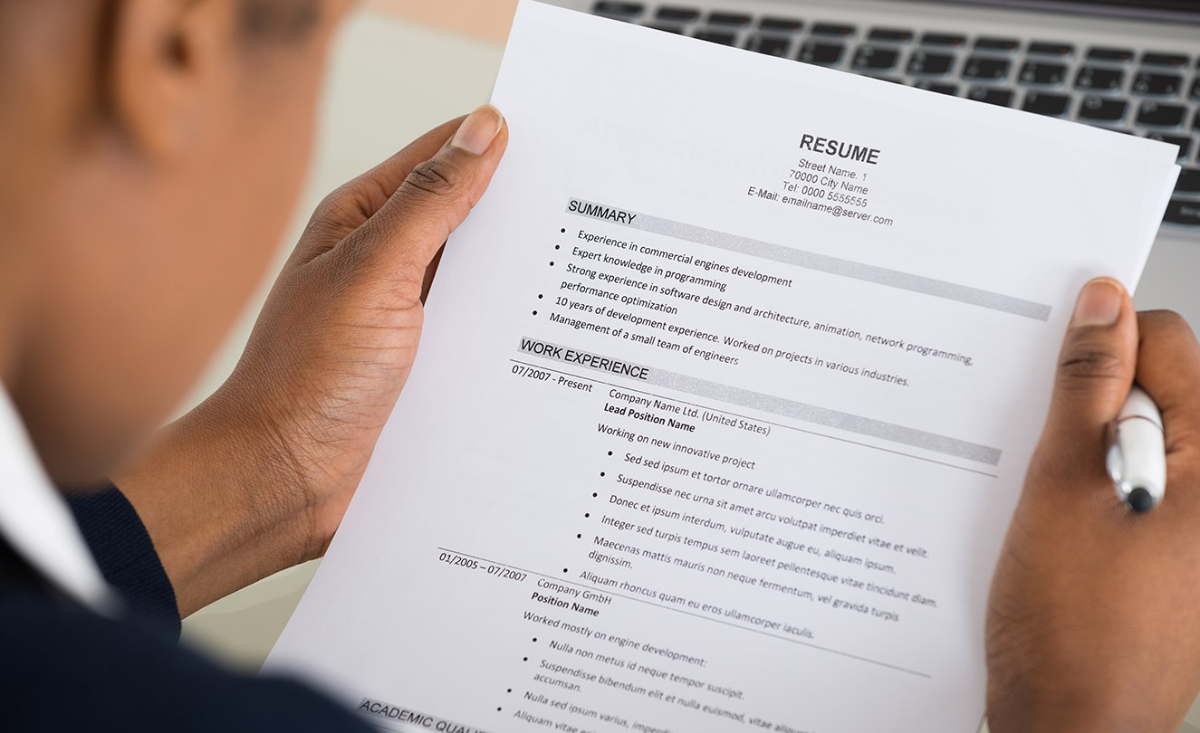 Hiring manager reading candidates resume
